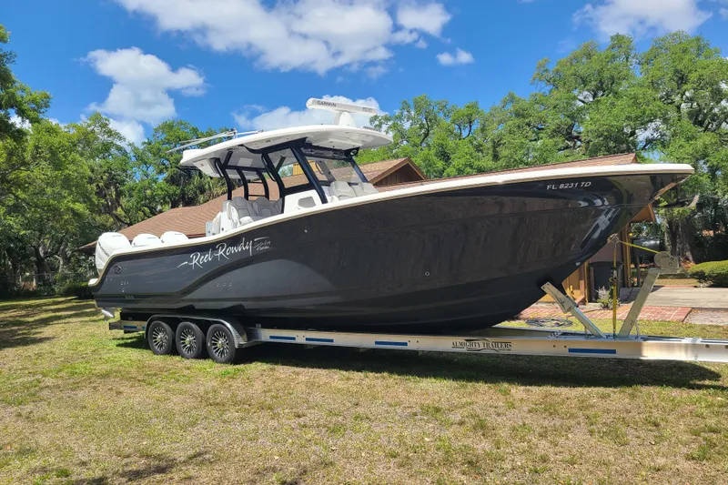 The Image of 2022 Sea Fox 368 Commander boat on trailer, parked outdoors under a clear blue sky. - 0