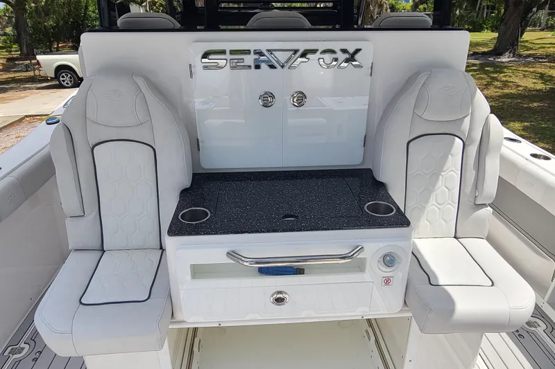 Slide: The Image of 2022 Sea Fox 368 Commander boat interior with seating and storage. - 12