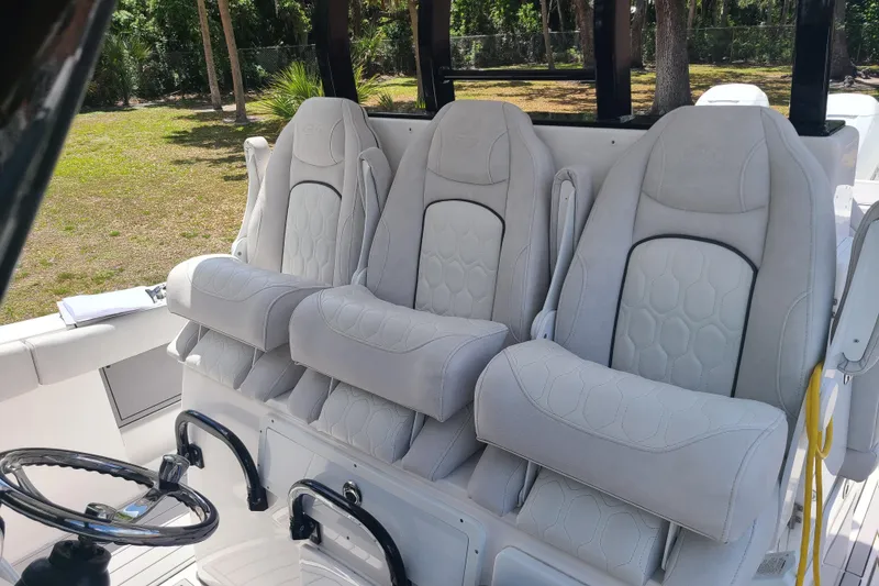 Slide: The Image of Luxury seating on 2022 Sea Fox 368 Commander boat, featuring plush white upholstery. - 17