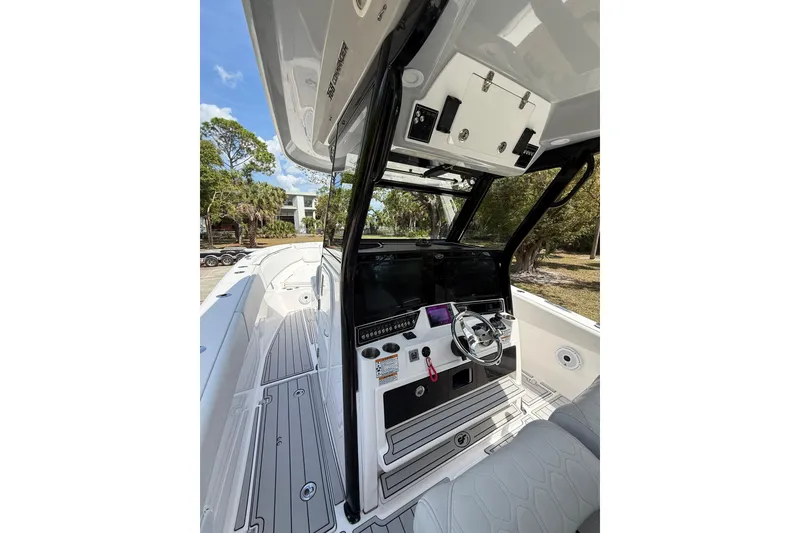 Slide: The Image of 2022 Sea Fox 368 Commander boat interior with modern helm and sleek design. - 19