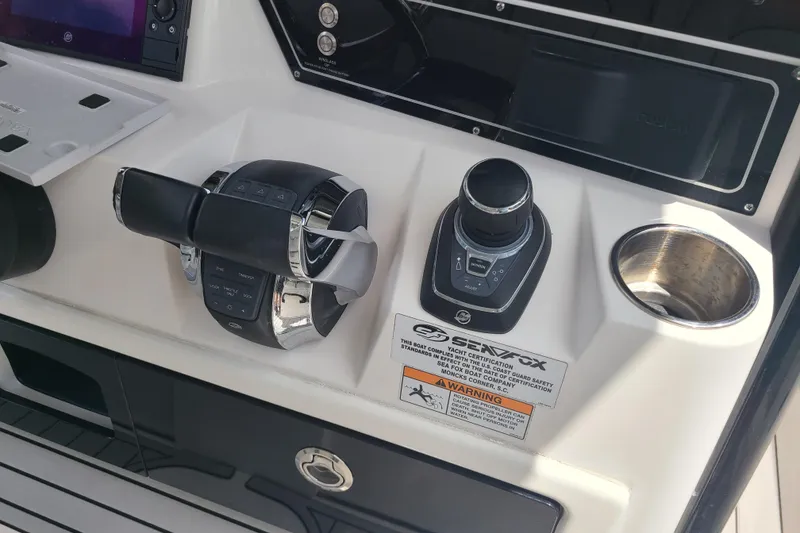 Slide: The Image of Control panel of 2022 Sea Fox 368 Commander boat with throttle and joystick. - 24