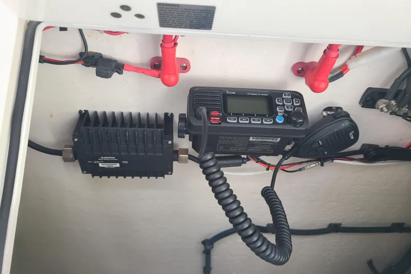 Slide: The Image of Electrical equipment inside a 2022 Sea Fox 368 Commander boat, featuring communication devices and wiring. - 25