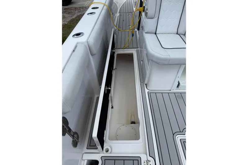 Slide: The Image of 2022 Sea Fox 368 Commander boat interior with open storage compartment and seating. - 26