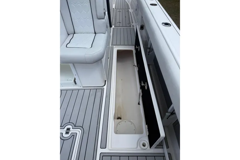 Slide: The Image of 2022 Sea Fox 368 Commander boat interior with open storage compartment and seating. - 27