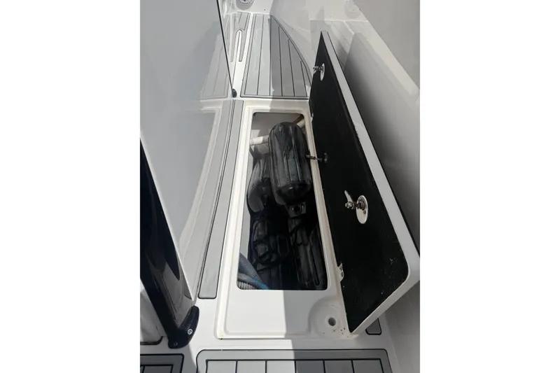 Slide: The Image of Open storage compartment on 2022 Sea Fox 368 Commander boat deck. - 29