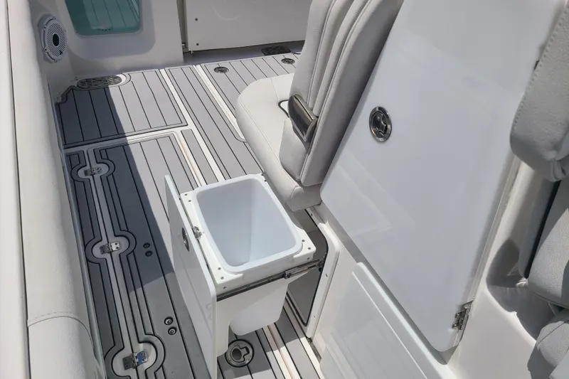 Slide: The Image of 2022 Sea Fox 368 Commander interior with open storage compartment and sleek seating. - 30