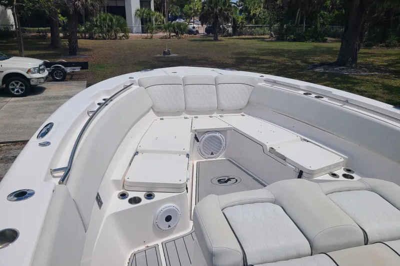 Slide: The Image of 2022 Sea Fox 368 Commander boat interior with white seating and deck. - 39