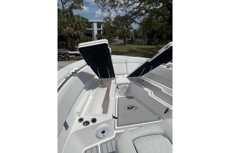 Slide: The Image of 2022 Sea Fox 368 Commander boat interior with open storage compartments and seating. - 40