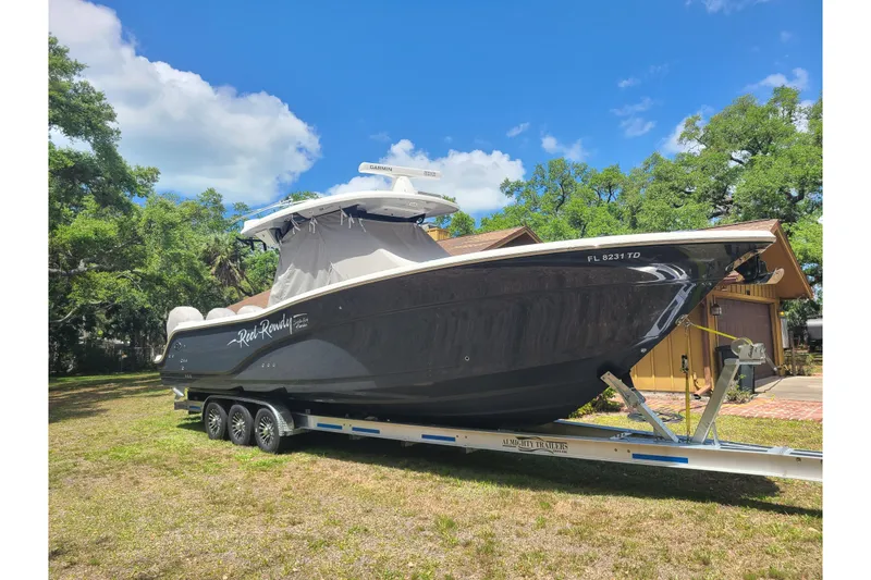 Slide: The Image of 2022 Sea Fox 368 Commander boat on trailer, parked outdoors under blue sky. - 46