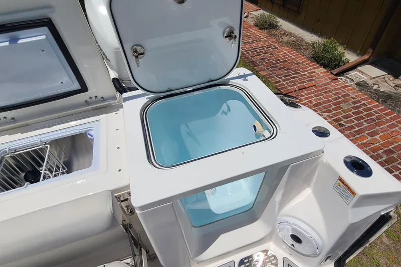 Slide: The Image of Open storage compartments on a 2022 Sea Fox 368 Commander boat, showcasing utility features. - 8
