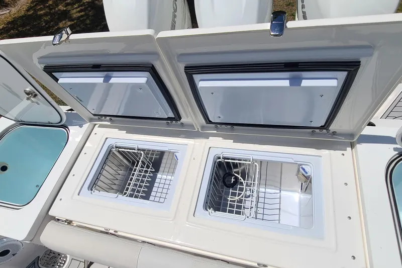 Slide: The Image of Open storage compartments on a 2022 Sea Fox 368 Commander boat. - 9