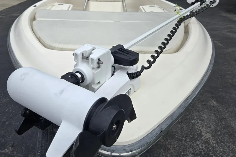 Slide: The Image of 2006 ShearWater 2400Z boat with trolling motor on deck. - 10