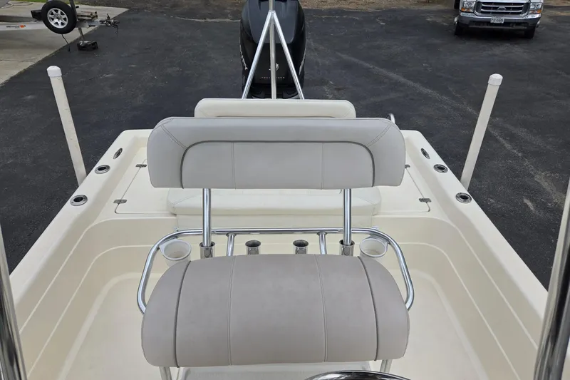 Slide: The Image of 2006 ShearWater 2400Z boat interior with seating and rod holders. - 14