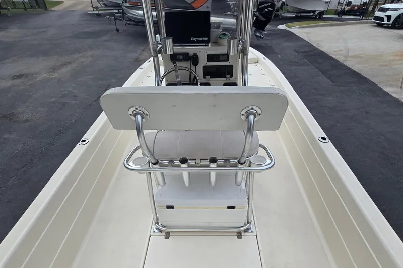 Slide: The Image of 2006 ShearWater 2400Z boat interior with steering console and seating. - 16