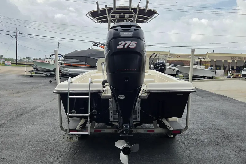 Slide: The Image of 2006 ShearWater 2400Z boat with 275 horsepower engine, parked on a trailer. - 4