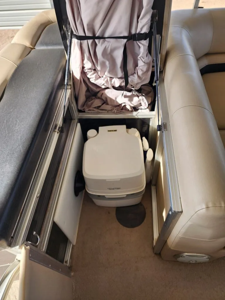 Slide: The Image of 2015 Lowe SS210 boat with built-in portable toilet. - 13