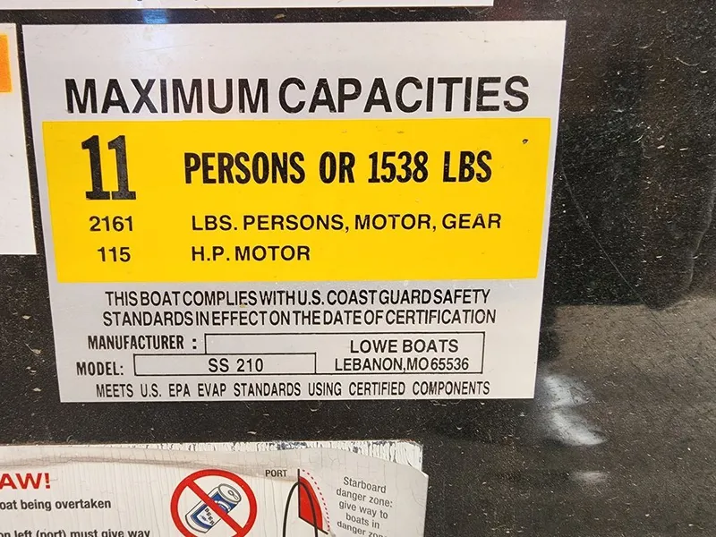 Slide: The Image of Capacity label for Lowe SS210 boat, 11 persons or 1538 lbs. - 15