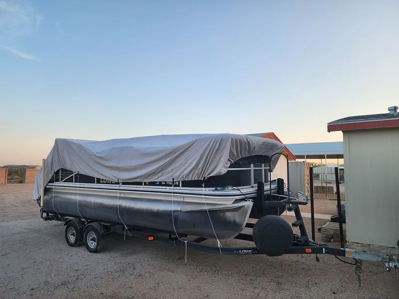 Slide: The Image of Covered 2015 Lowe SS210 pontoon boat on trailer. - 3