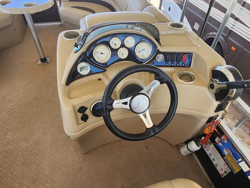 Slide: The Image of Steering console of a 2015 Lowe SS210 pontoon boat. - 8
