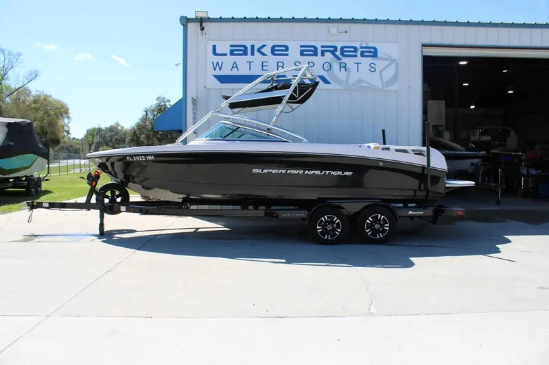 The Image of 2007 Nautique Super Air Nautique 230 boat on trailer at Lake Area Watersports. - 1