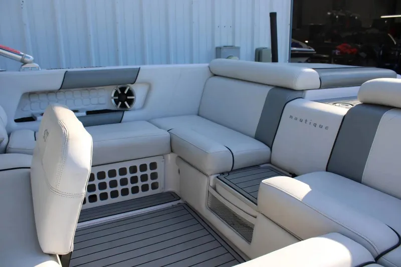 Slide: The Image of Luxurious interior of 2007 Nautique Super Air Nautique 230 boat with plush seating. - 13
