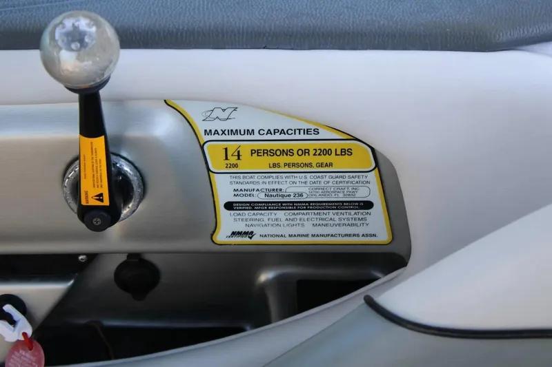 Slide: The Image of 2007 Nautique Super Air Nautique 230 capacity label, indicating 14 persons or 2200 lbs limit. - 5