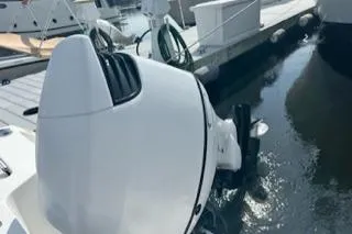 Slide: The Image of 2006 Sea Hunt Triton 220 boat engine docked at marina. - 10