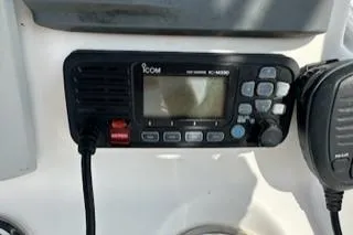 Slide: The Image of ICOM marine radio on 2006 Sea Hunt Triton 220 boat dashboard. - 15