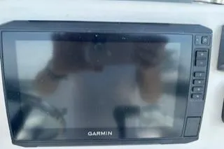 Slide: The Image of Garmin marine GPS device on 2006 Sea Hunt Triton 220 boat dashboard. - 28