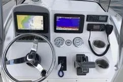 Slide: The Image of Dashboard of a 2006 Sea Hunt Triton 220 boat with navigation instruments. - 3