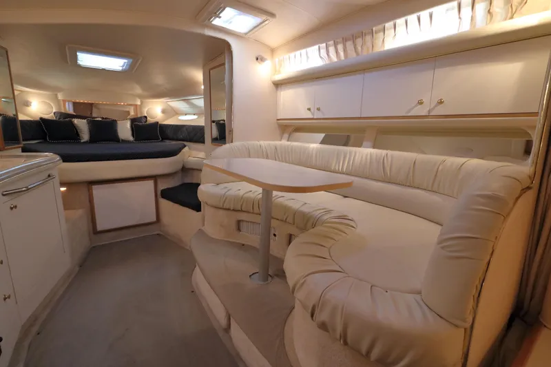 Slide: The Image of Luxurious interior of a 2000 Sea Ray 340 Sundancer yacht with plush seating and elegant design. - 13