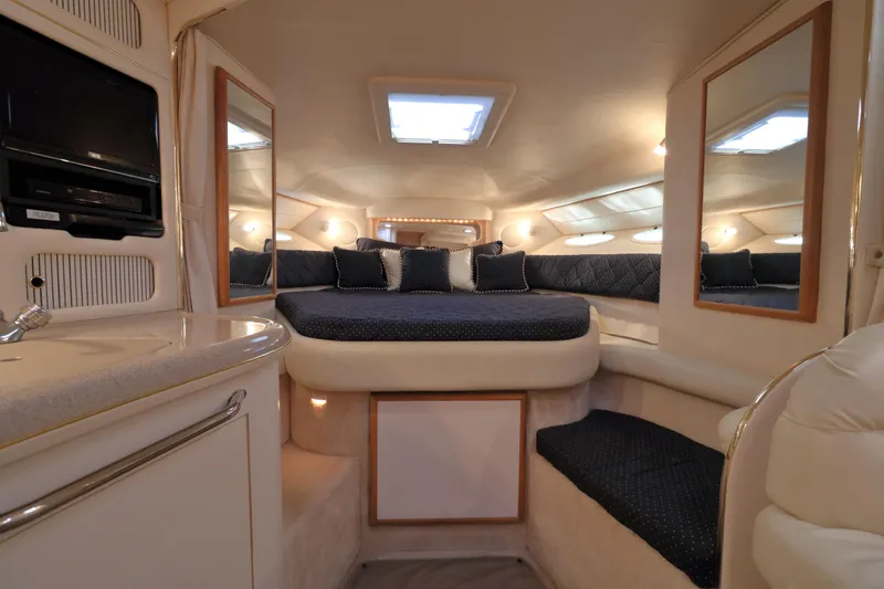 Slide: The Image of Luxurious interior of 2000 Sea Ray 340 Sundancer yacht with cozy bed and elegant decor. - 15