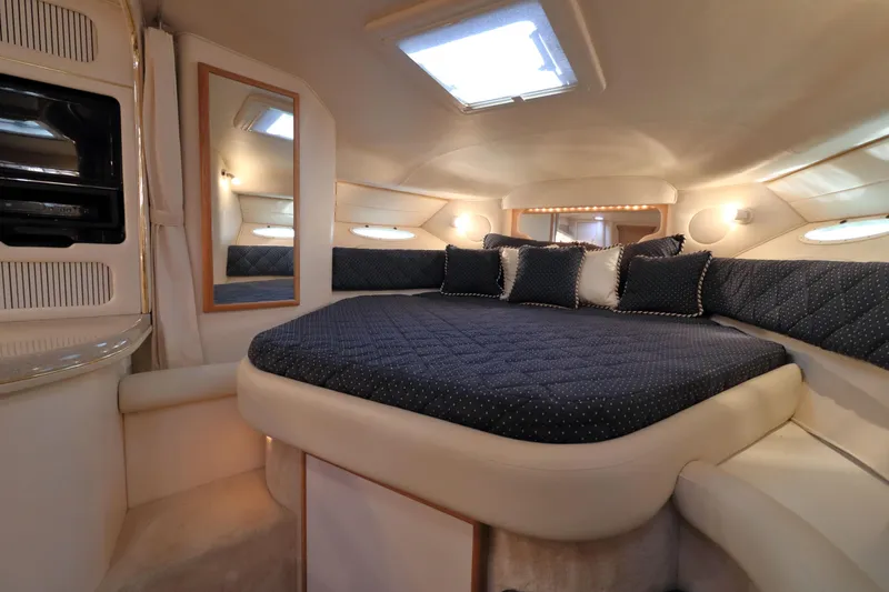 Slide: The Image of Luxurious interior cabin of 2000 Sea Ray 340 Sundancer yacht with plush bedding. - 16