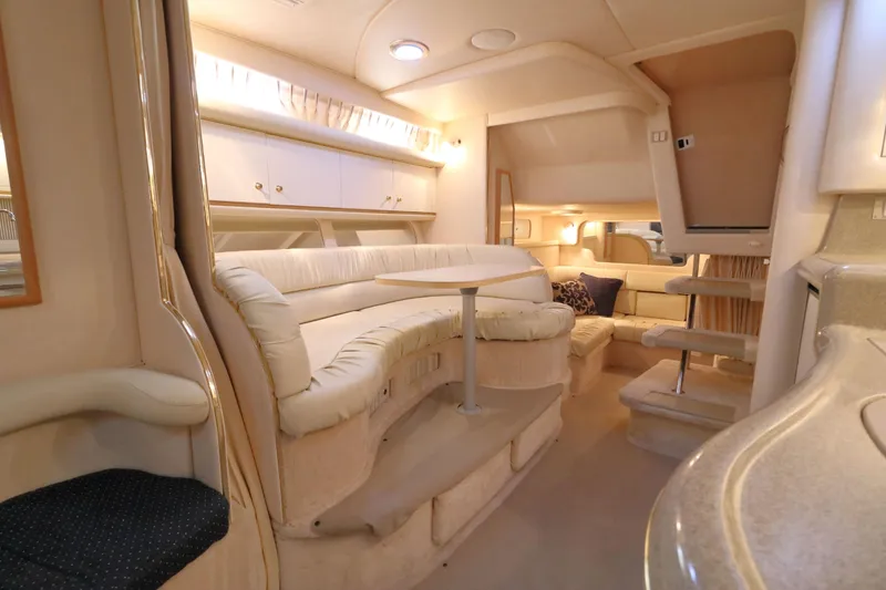 Slide: The Image of Luxurious interior of a 2000 Sea Ray 340 Sundancer yacht with plush seating and modern amenities. - 18