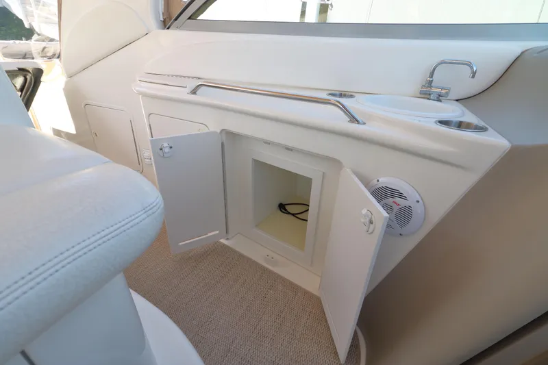 Slide: The Image of Interior of 2000 Sea Ray 340 Sundancer with open cabinet and sink area. - 2