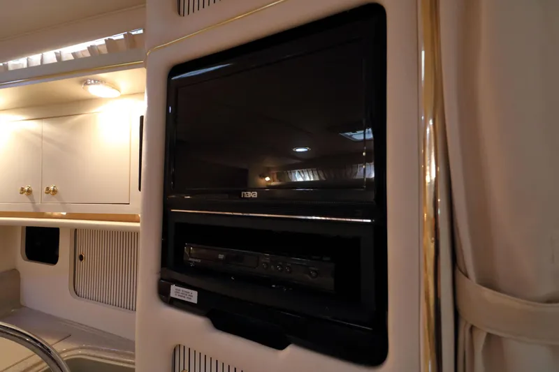 Slide: The Image of Interior of 2000 Sea Ray 340 Sundancer with built-in TV and DVD player. - 22