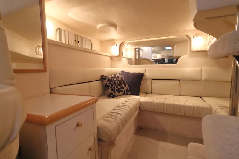 Slide: The Image of Interior of 2000 Sea Ray 340 Sundancer yacht with cozy seating and elegant decor. - 23