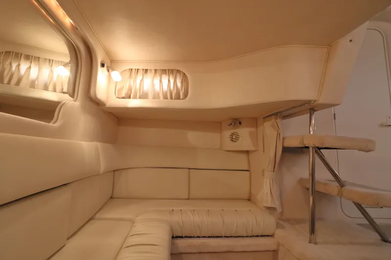 Slide: The Image of Luxurious interior of a 2000 Sea Ray 340 Sundancer yacht with plush seating and ambient lighting. - 25