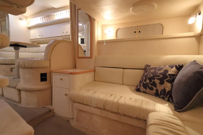 Slide: The Image of Luxurious interior of 2000 Sea Ray 340 Sundancer yacht with plush seating and elegant decor. - 26