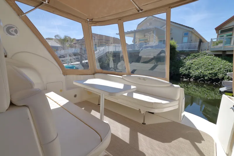 Slide: The Image of Interior view of a 2000 Sea Ray 340 Sundancer boat with seating and table. - 3