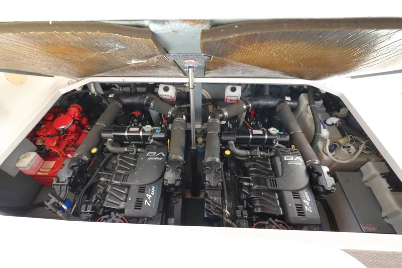 Slide: The Image of Engine compartment of a 2000 Sea Ray 340 Sundancer boat, showcasing dual engines. - 30