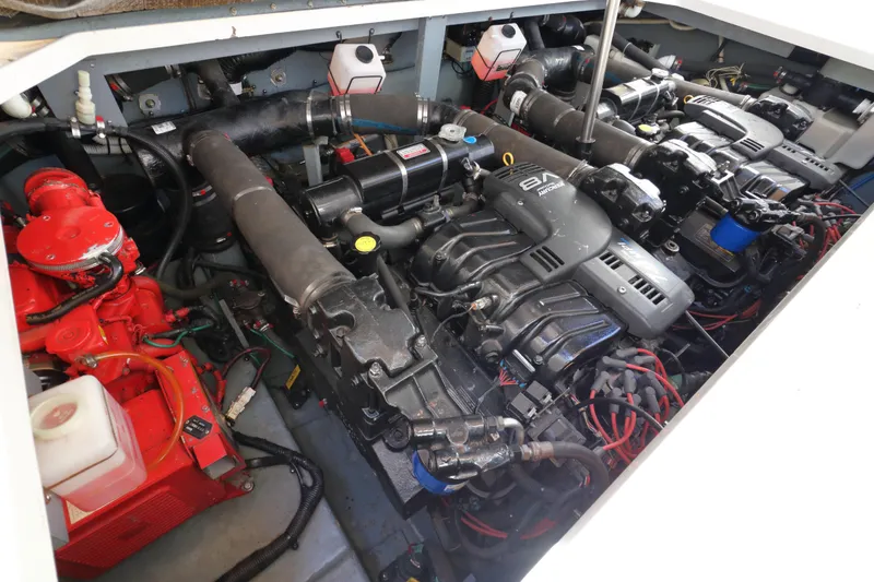 Slide: The Image of Engine compartment of a 2000 Sea Ray 340 Sundancer boat, showcasing dual engines and components. - 31