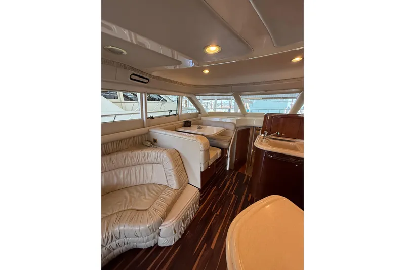 Slide: The Image of Luxurious interior of a 1999 Sea Ray 560 Sedan Bridge yacht with plush seating and elegant design. - 29