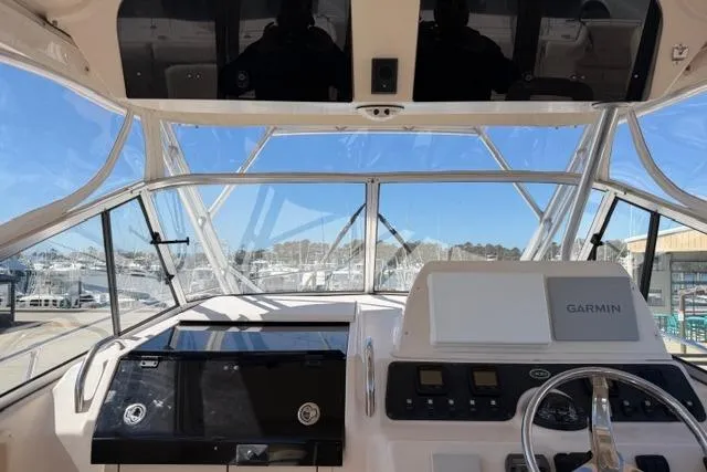 Slide: The Image of 2007 Grady-White Marlin 300 helm with Garmin navigation system, docked at marina. - 13