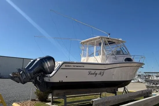 Slide: The Image of 2007 Grady-White Marlin 300 boat on display, featuring dual outboard motors. - 2