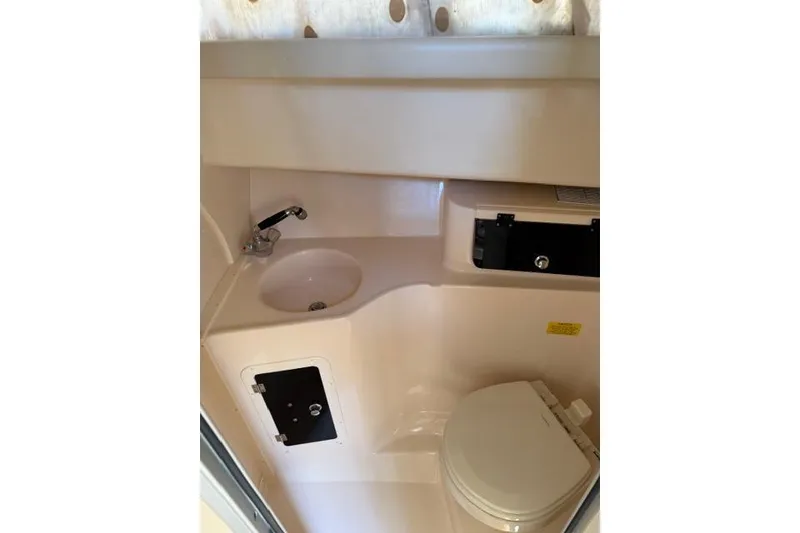 Slide: The Image of 2007 Grady-White Marlin 300 boat bathroom with sink and toilet. - 26