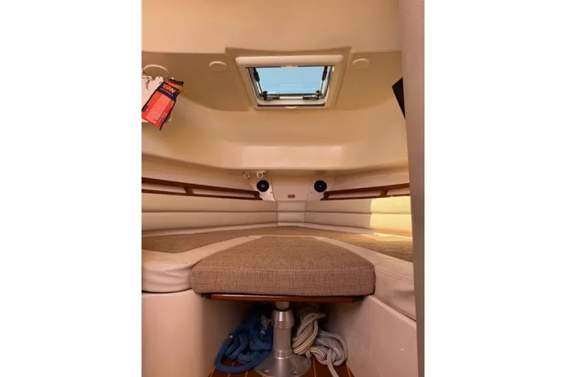 Slide: The Image of Interior cabin of 2007 Grady-White Marlin 300 boat with cushioned seating and hatch. - 28