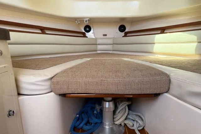 Slide: The Image of Interior cabin of 2007 Grady-White Marlin 300 boat with cushioned seating and ropes. - 29