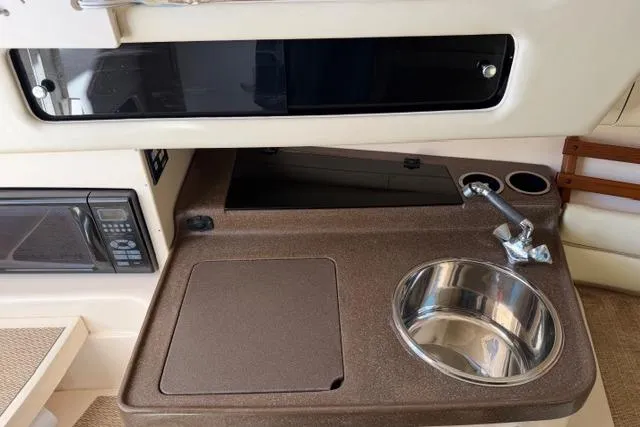 Slide: The Image of 2007 Grady-White Marlin 300 boat interior with sink and countertop area. - 31