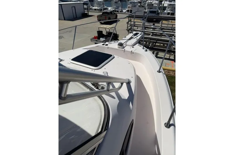 Slide: The Image of 2007 Grady-White Marlin 300 boat deck with railing and hatch, docked at marina. - 42